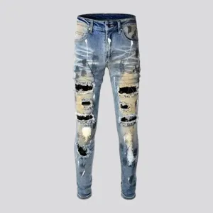 Whiskered crystal-patch jeans